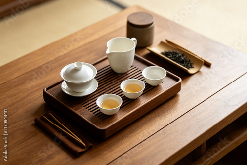 Flat lay top‑down view of traditional chinese tea ceremony set on wooden tea table