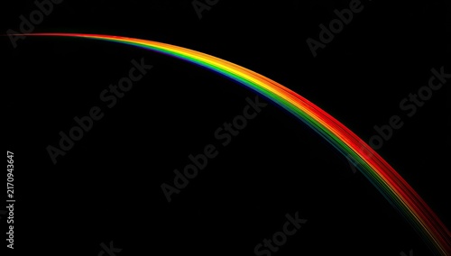 A vibrant rainbow arc against a black background