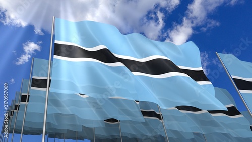 Multiple Botswana flags waving on blue sky