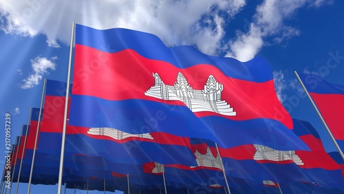 Multiple Cambodia flags waving on blue sky