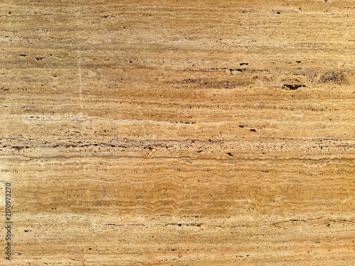 Beige travertine marble stone texture background full frame natural porous limestone wall tile surface pattern rough sandstone floor design element seamless architecture material detail close up.