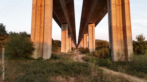 Concrete highway pillars creating a symmetrical perspective
