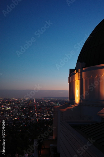 Nighttime view of the downtown Los Angeles skyline from a hillside overlook