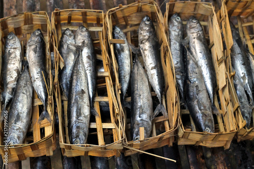Fresh Fish in Bamboo Baskets at a Traditional Market Packed in Neat Rows for Sale