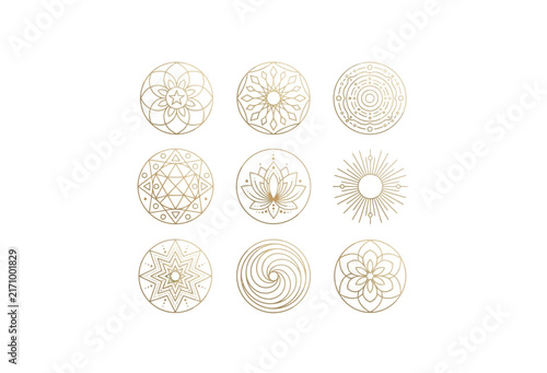Golden floral ornaments arranged in a grid pattern on a white background
