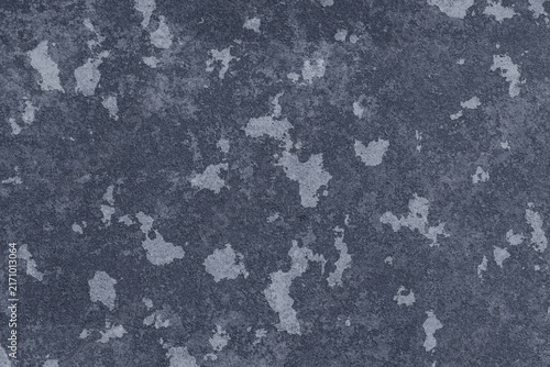 Dark blue mottled stone wall texture background