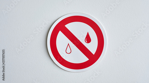 Single water safety warning label isolated on plain seamless studio background soft studio lighting centered minimal composition, water treatment plant education literacy
