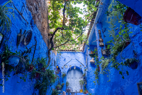 A small blue colored courtyard in Chefchaouen, Morocco. Chefchaouen is a small city in the Rif Mountains and is often referred to as the “blue city” or the “blue pearl of Morocco”. 