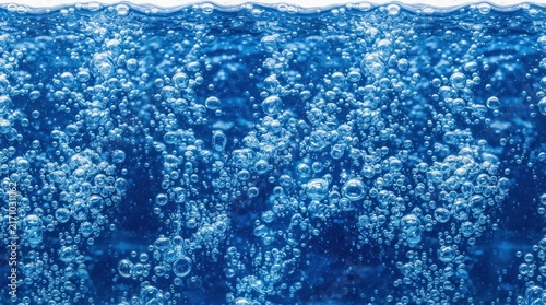 Abstract underwater background with many rising air bubbles in deep blue water.