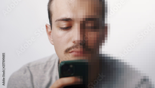 Digital Privacy Concept: Man with Pixelated Face Holding Smartphone