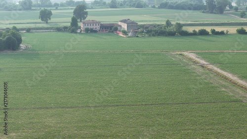 Canvas Print Aerial perspective of a farmer diligently operating a tractor, precisely applyin