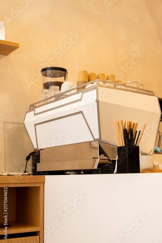 Принти на полотні Modern espresso machine on white counter in minimalist specialty coffee shop wit