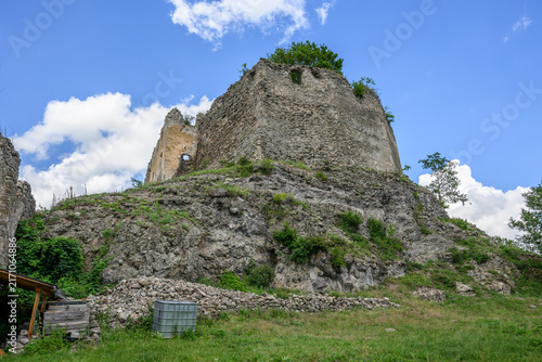 Fotografie Ruined keep of Cabrad Castle rising on its rocky crag against a blue summer sky,