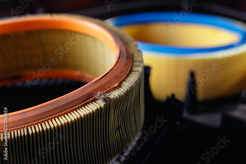 Canvas Print Close up damaged air filter pleats inside vehicle engine compartment