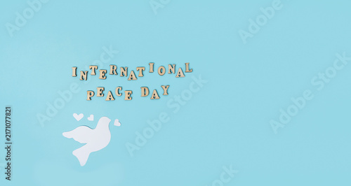 Картината върху платно International Peace Day concept with white dove, hearts and inspirational messag