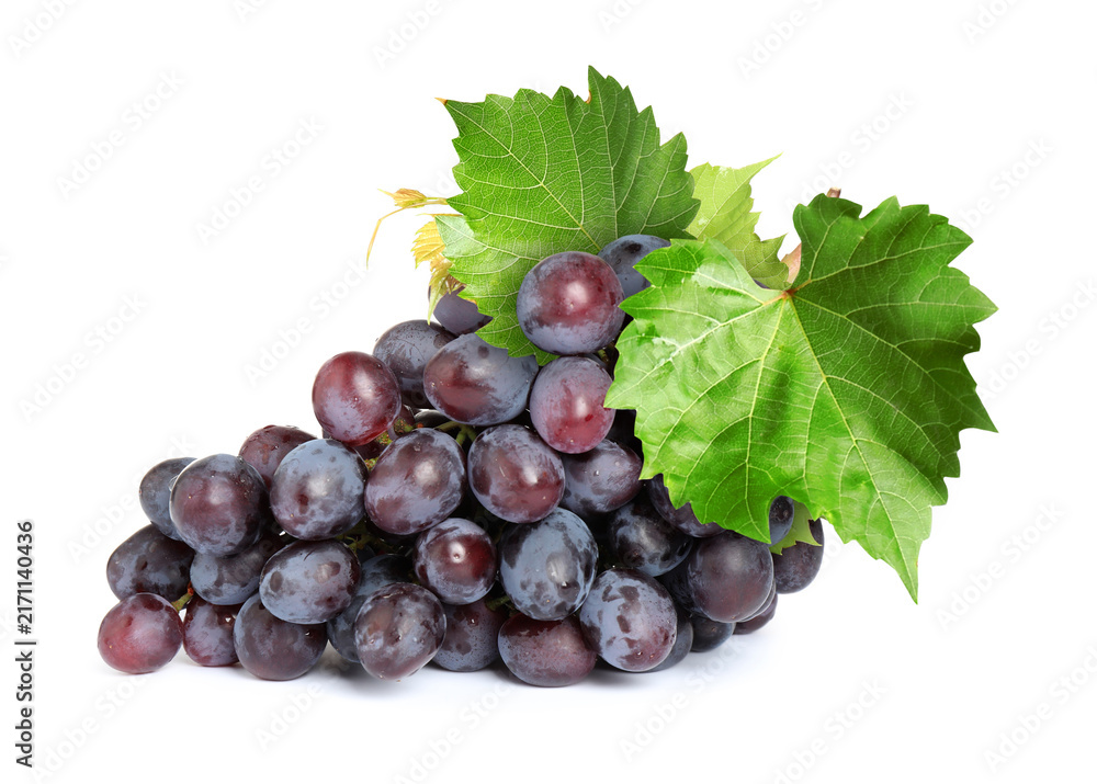Fototapeta premium Bunch of grapes with green leaves isolated on white