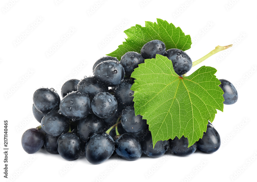 Fototapeta premium Bunch of fresh ripe grapes with green leaves isolated on white