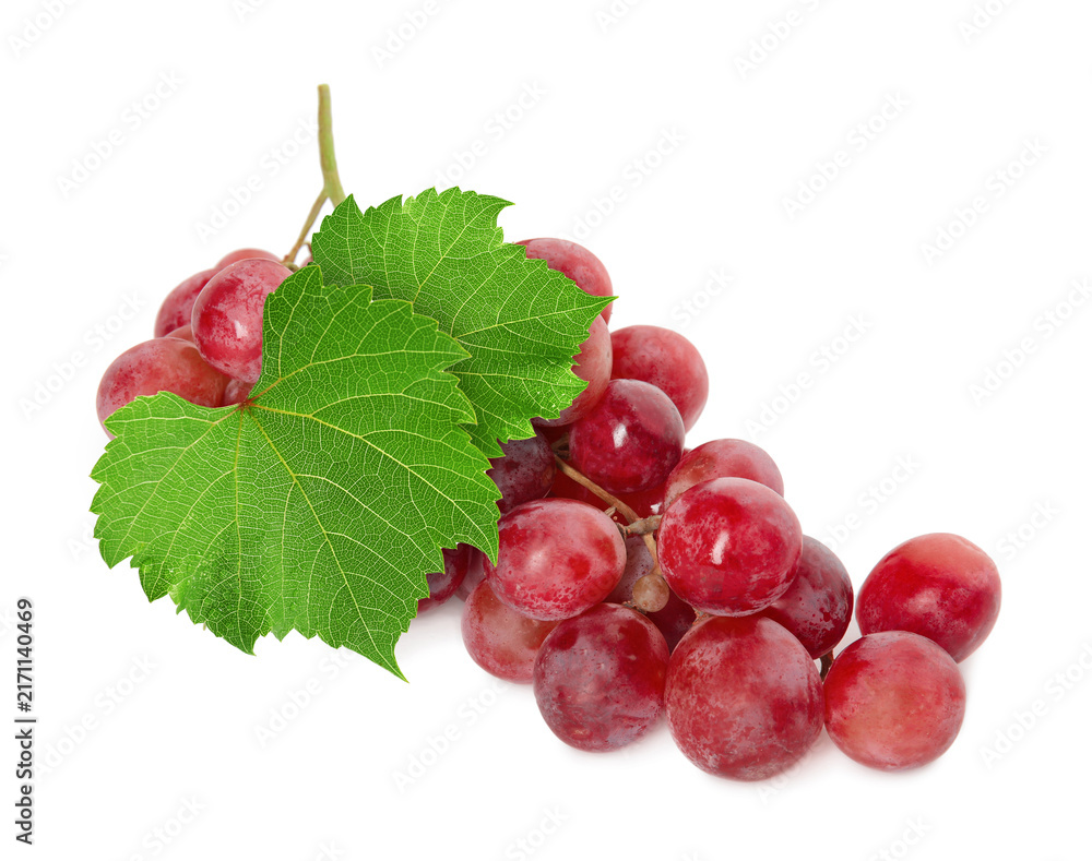 Fototapeta premium Bunch of grapes with green leaves isolated on white