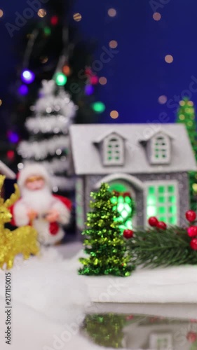 A yellow car quickly drives into a Christmas village