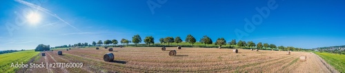 Aerial view of harvested grain fields with straw bales in the Taunus region in late summer