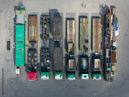 Aerial view of trucks used for transport of demolition materials and equipment parked in a row at a construction site in Middenmeer, Noord-Holland, Netherlands.