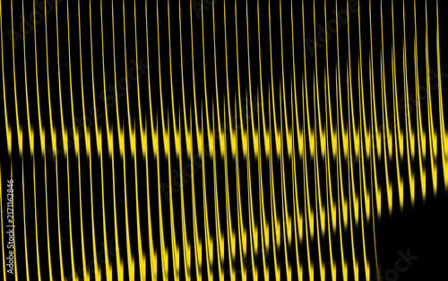 Abstract yellow light streaks on black background, vertical glowing lines pattern texture