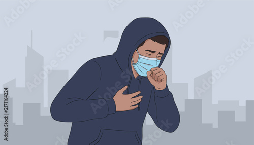 Ill young man wearing a medical face mask coughing in front of a grey polluted city skyline showing heavy smog.