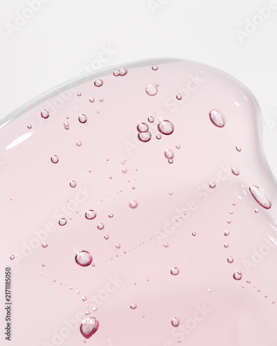 Pink cosmetic serum gel smear with bubbles macro skincare texture on white background