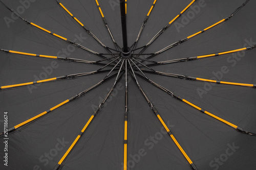 Abstract Black Umbrella Interior with Yellow Ribs — Radial Symmetry Pattern