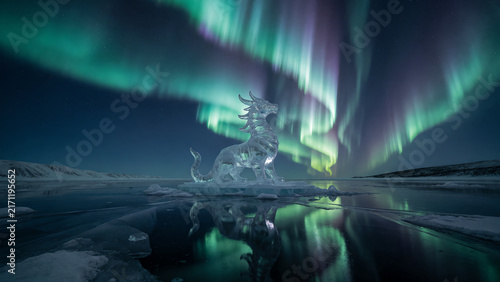 A beautiful ice dragon sculpture standing on a frozen lake under the vibrant northern lights.