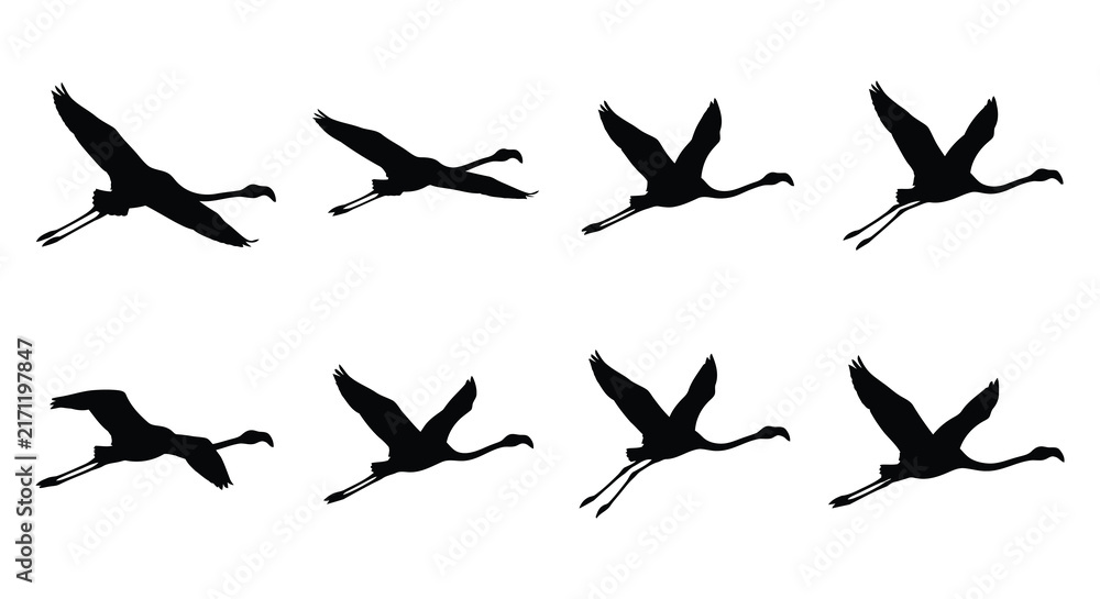 Naklejka premium Black silhouettes of flying cranes depict a dynamic vector illustration
