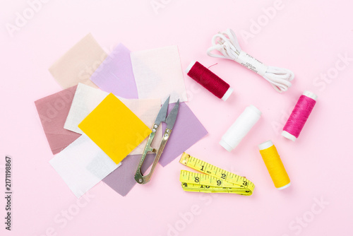 Obraz na plátne Sewing and needlework accessories on color background, top view