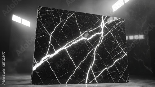 Luxurious black marble slab illuminated in a dark studio with dramatic lighting and design