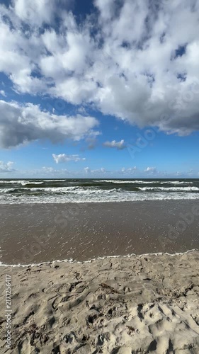 The Baltic Sea in summer, the shore and waves in beautiful, sunny weather.