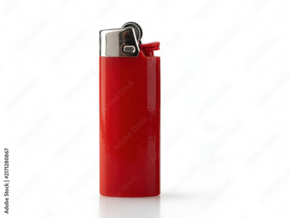 Fototapeta premium Red plastic lighter with silver metal nozzle stands vertically on white background. Compact butane tool for fire smoking. Shiny pocket accessory used to ignite flames for gas combustion. Simple