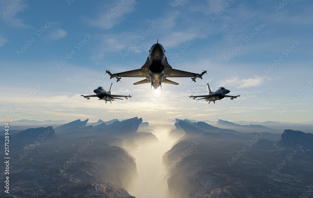Obraz premium Three Fighter Jets Flying in Tight Formation Over Misty Mountain Canyon at Sunrise