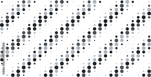 Diagonal pattern of circles in varying sizes and shades of gray and black arranged in a rhythmic sequence on a white background