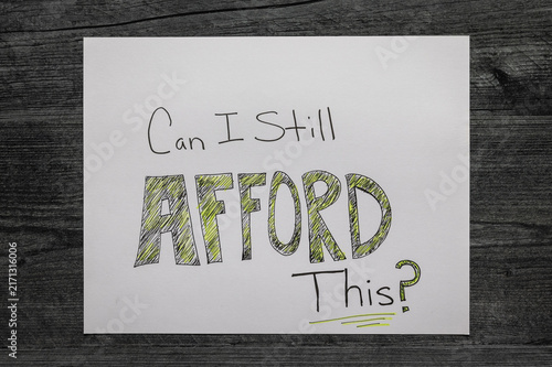 Foto Can I Still Afford This? Financial concept flat lay photo hand written on white sheet paper