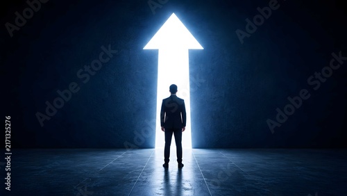 Businessman standing before a large glowing upward arrow doorway in a dark room, symbolizing career opportunity, leadership, and business vision.