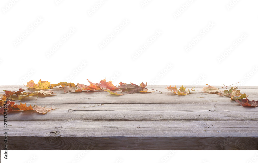 Naklejka premium Autumn Fallen Leaves on a Rustic Wooden Table on transparent background. Light Through the Leaves. Autumn Product podium png 