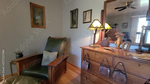 Cozy living room with wooden dresser and green armchair
