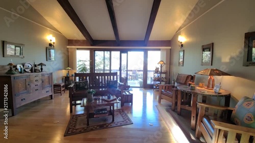 Bright living room with glass doors opening to patio