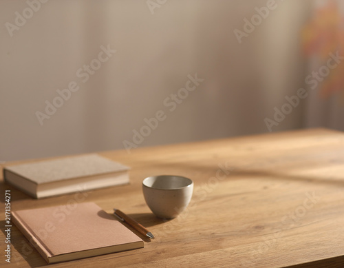 Quiet Autumn Desk Still Life with Books Cup and Copy Space