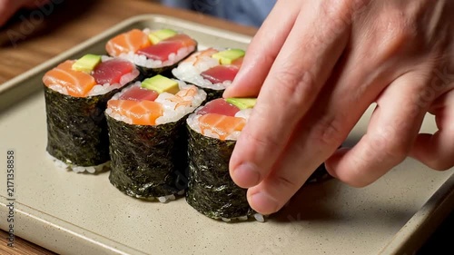 Top-Down Close-Up Of Sushi Hand Rolls Arranged Aesthetically On A Neutral Background For Culinary Presentation
