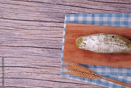 Konstfotografi Fresh sourdough dusted with flour sits on wooden board