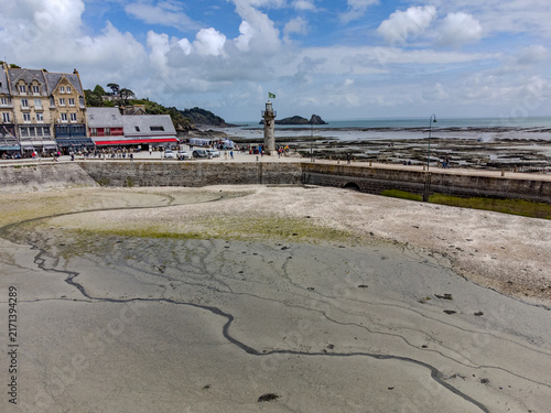 Obraz na plátně Aerial drone view of Cancale promenade and boats during low tide in Brittany, wi