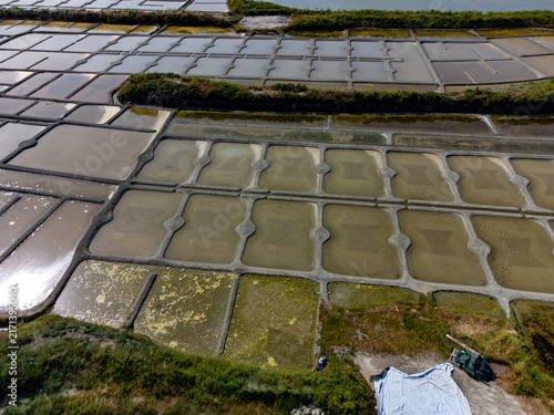 Obraz na plátne Aerial drone view of colorful saltpans in Guérande, Brittany, traditional salt h