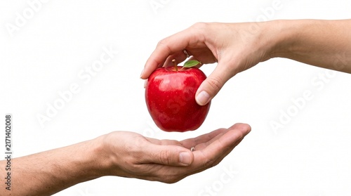 A woman's hand holding and giving a fresh red apple to an open man's hand against a white background.