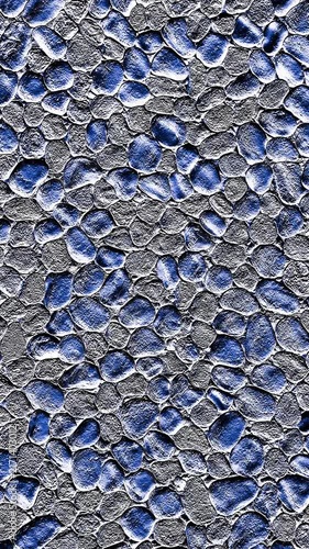 4K+ zoom in macro video of a blue washed terrazzo pebble dash wall. Dense irregular stones feature high-contrast natural silver highlights, deep shadows, and a gritty three-dimensional texture.