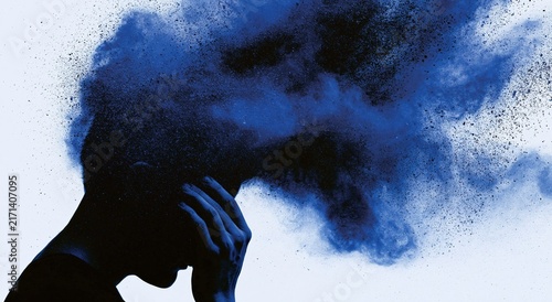 Mental health concept with silhouette of person and blue smoke of stress anxiety